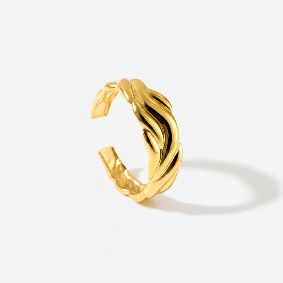Braided gold ring with intricate woven texture