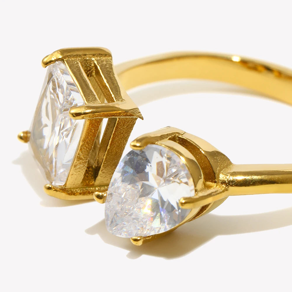Adjustable gold ring with a rectangular clear crystal stone
