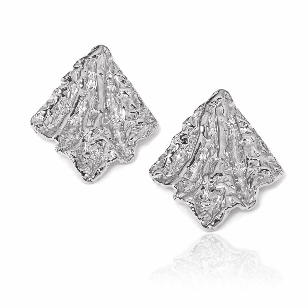 Textured organic silver earrings with modern sculptural finish