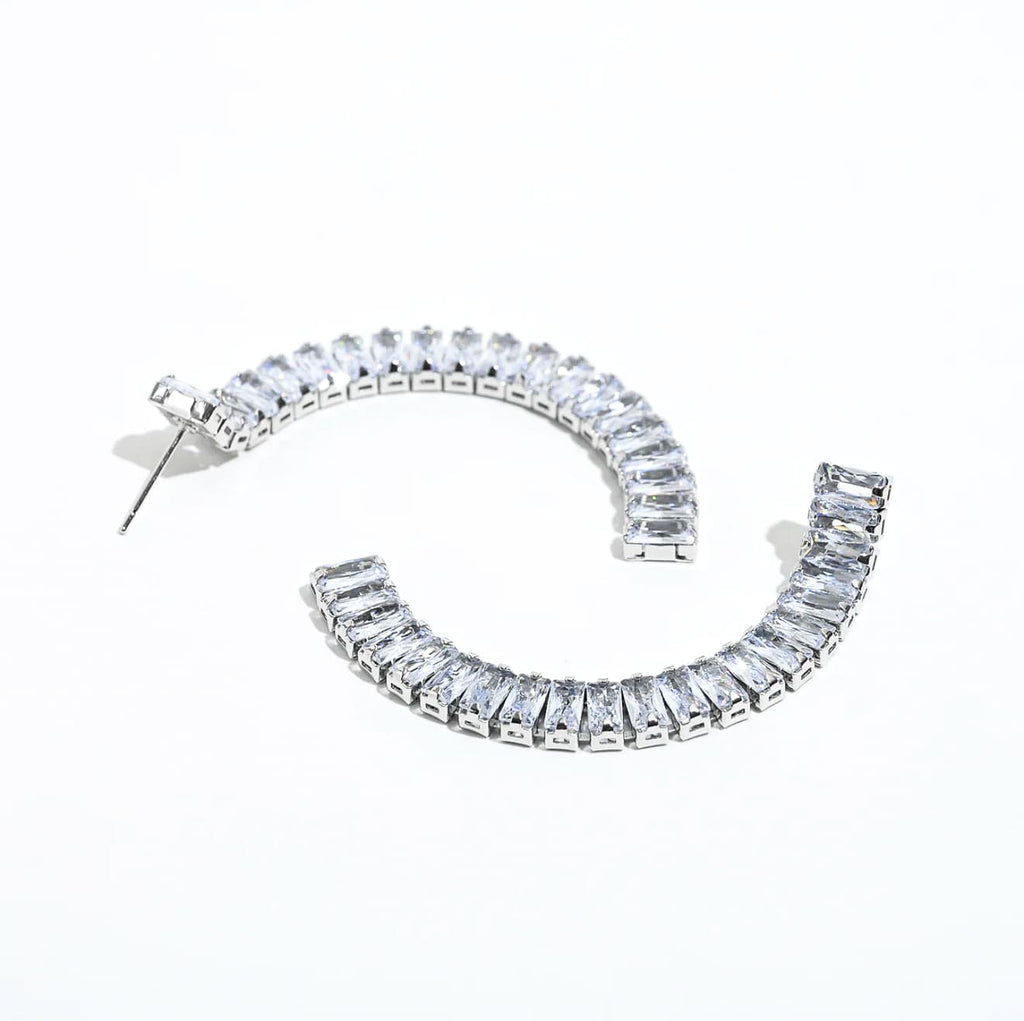 Silver crystal bar drop earrings with clear stones in curved design
