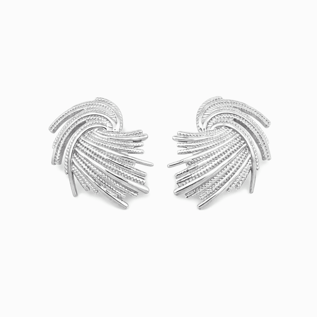 Silver statement earrings featuring an abstract fan-inspired design
