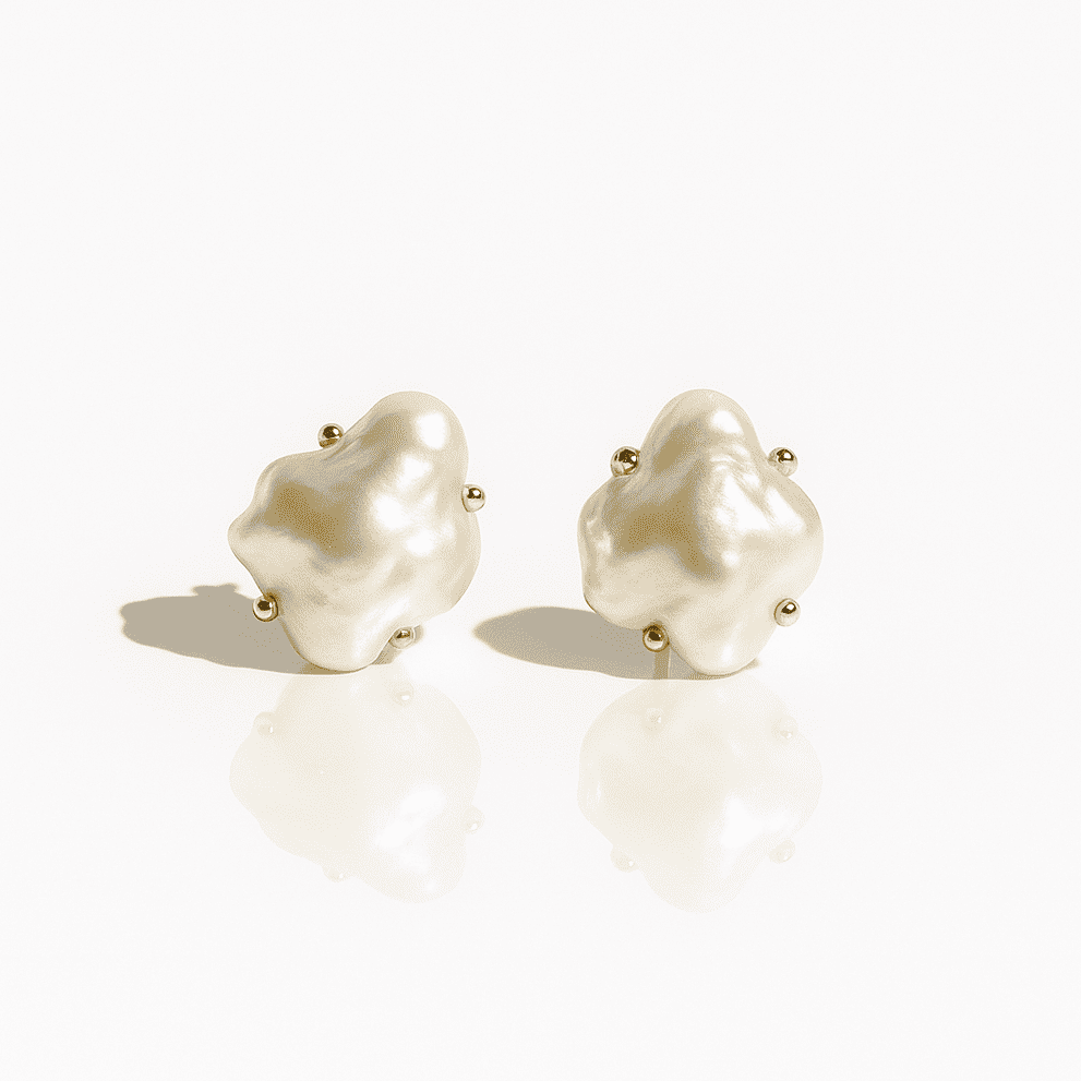 Baroque pearl stud earrings with gold accents, irregular organic shape, elegant modern jewelry photographed on a white background.