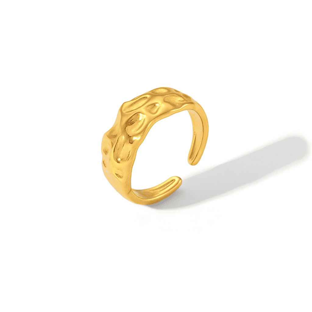 Adjustable textured gold ring with an organic hammered surface, minimalist modern jewelry on a white background.